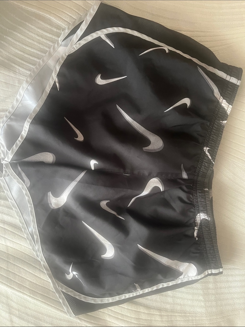 Nike Black Kids Shorts with White Swoosh Pattern